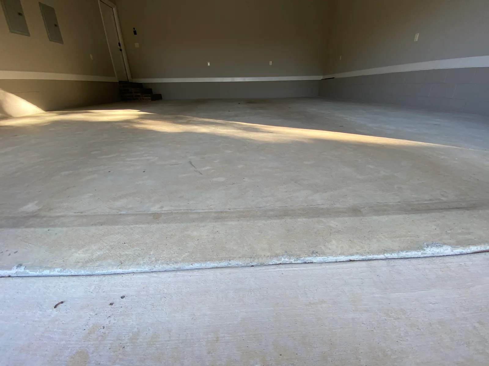 Bare garage floor before coating