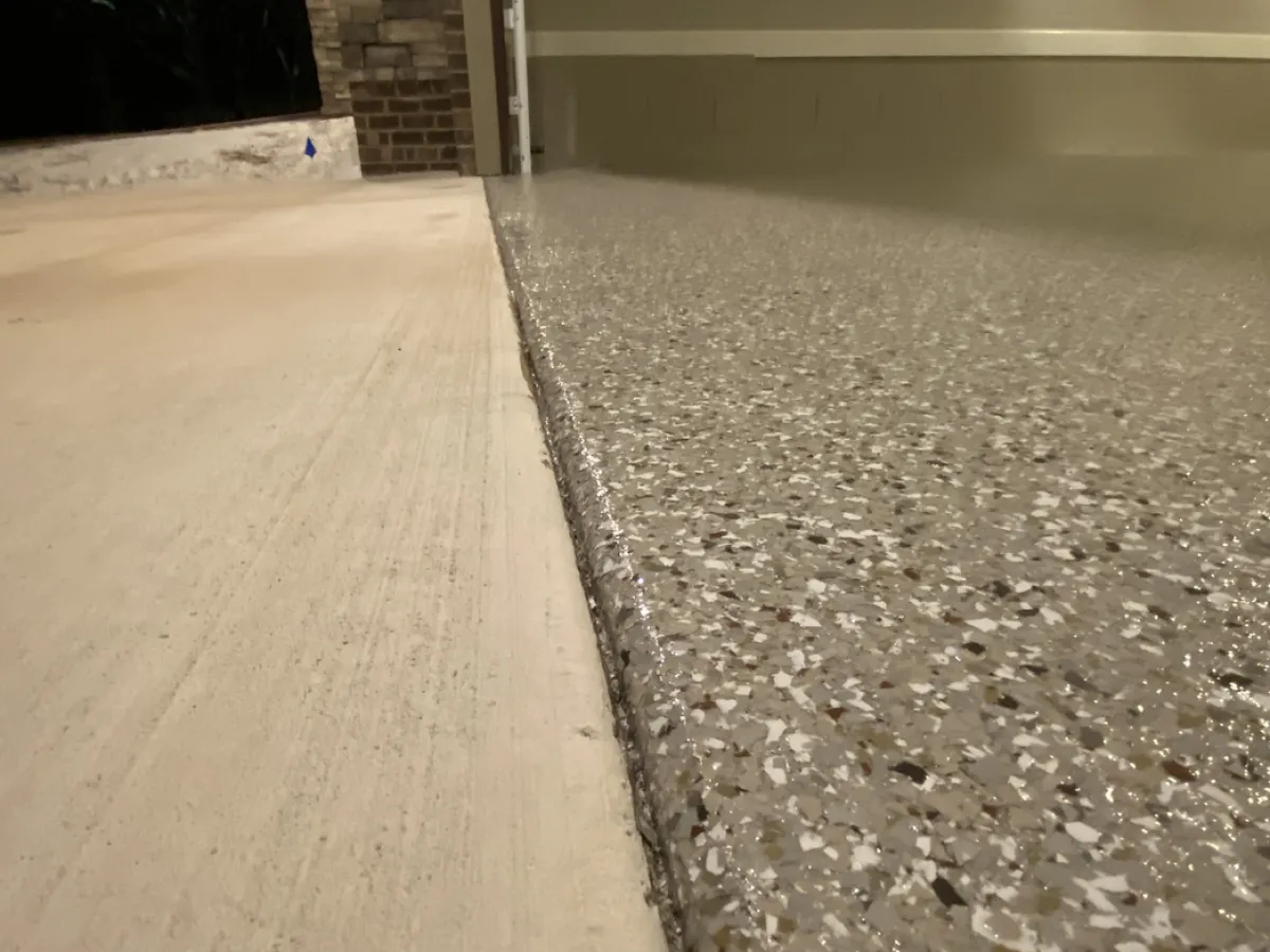 Finished flake-coated garage entry