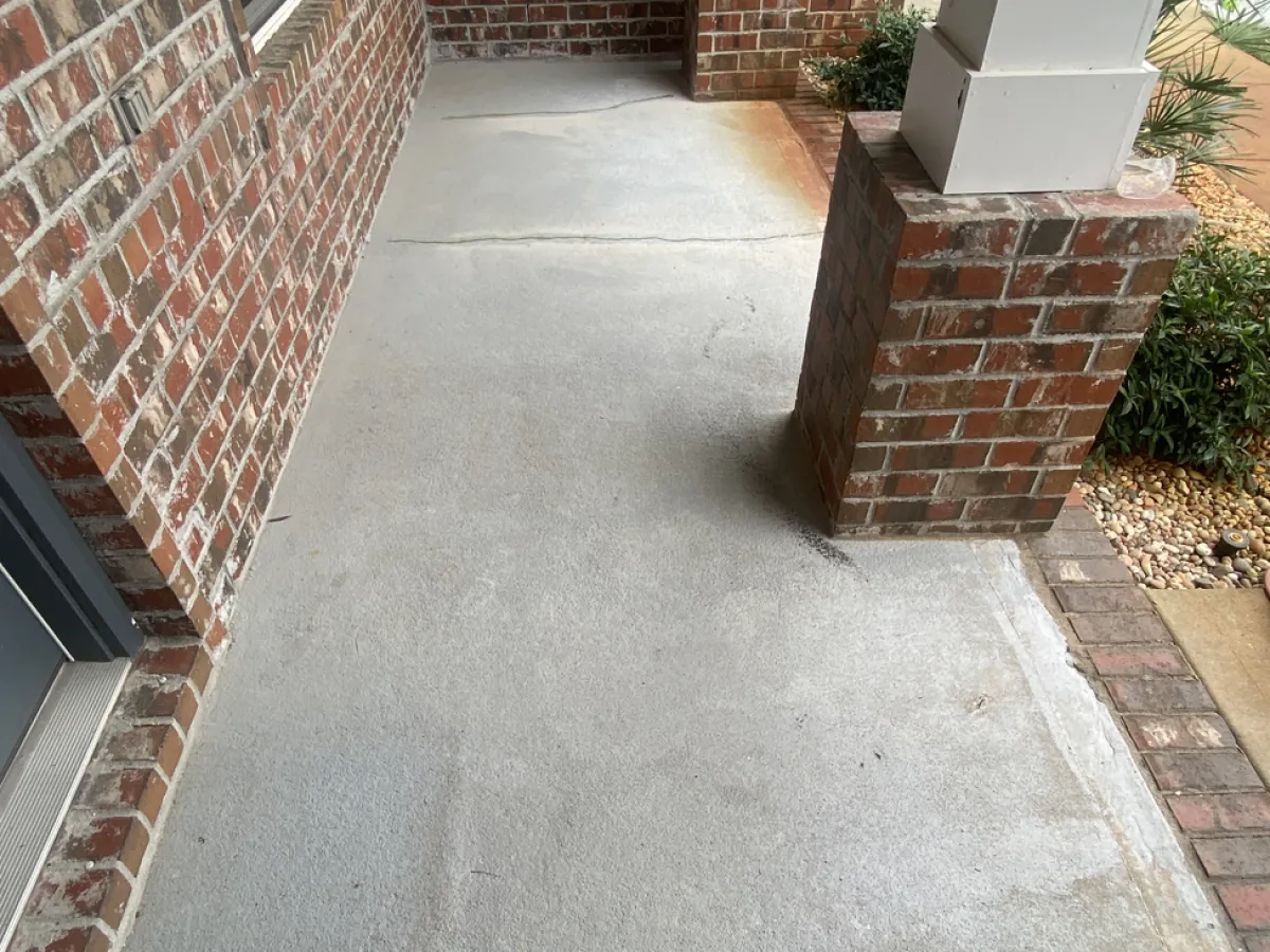 Bare concrete porch walkway before coating