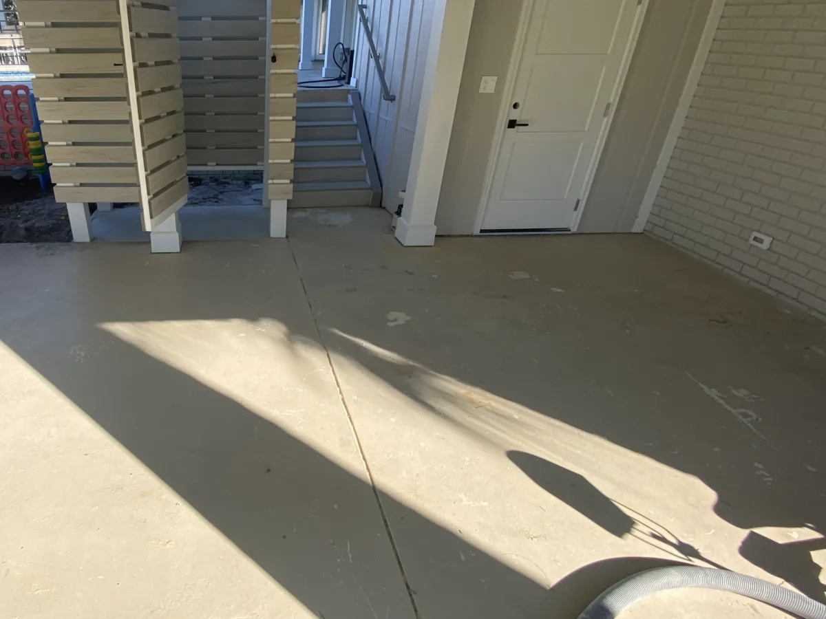 Bare concrete covered patio before coating