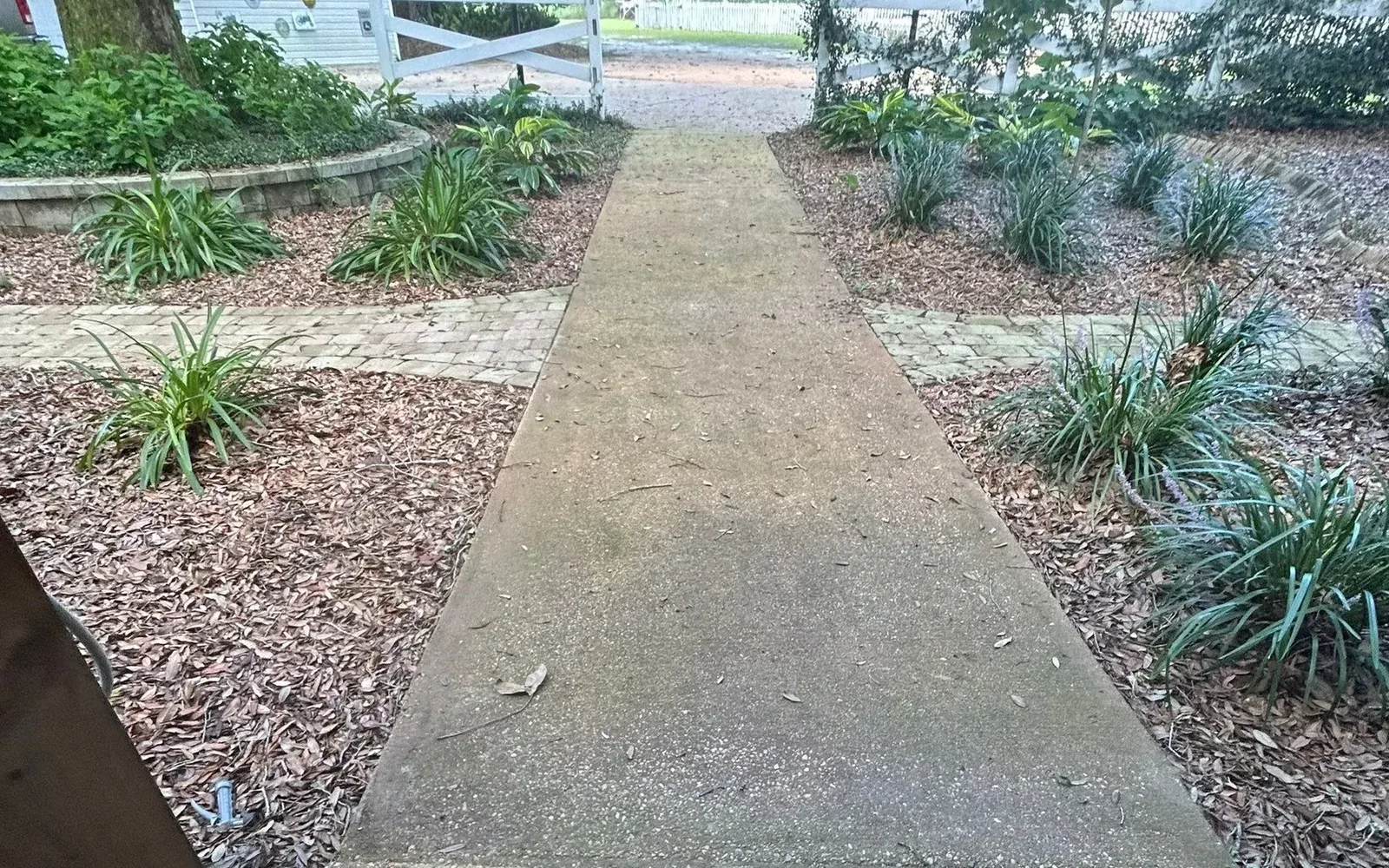Bare concrete walkway before coating in Pace